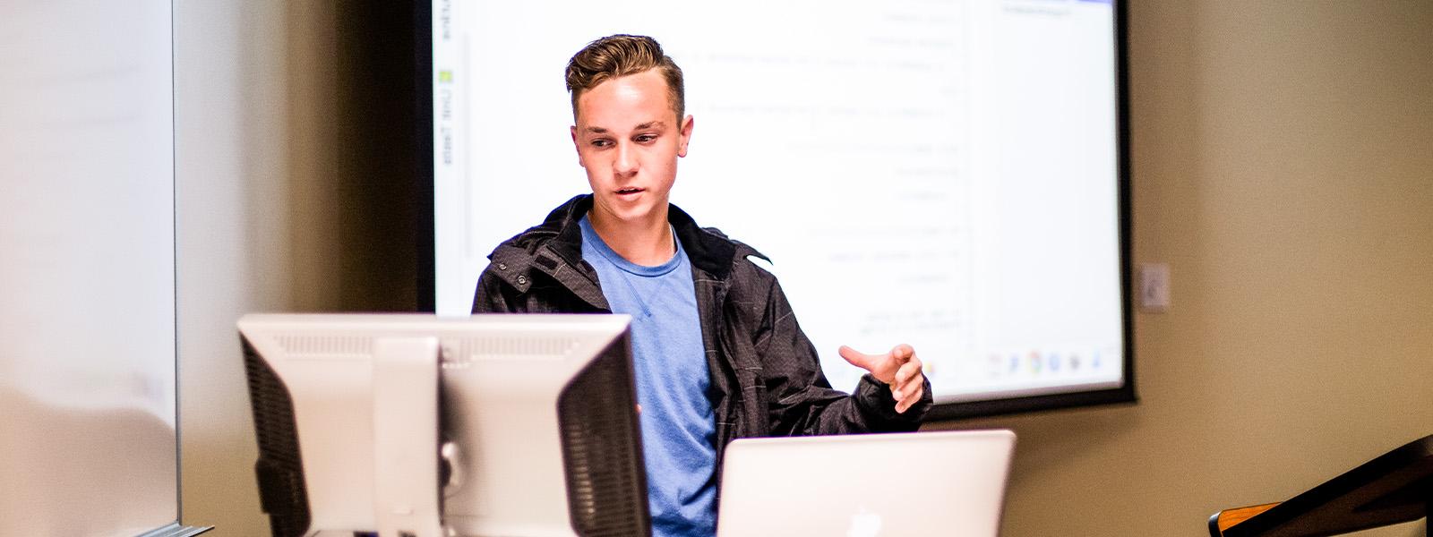 student teaching at the front of the classroom